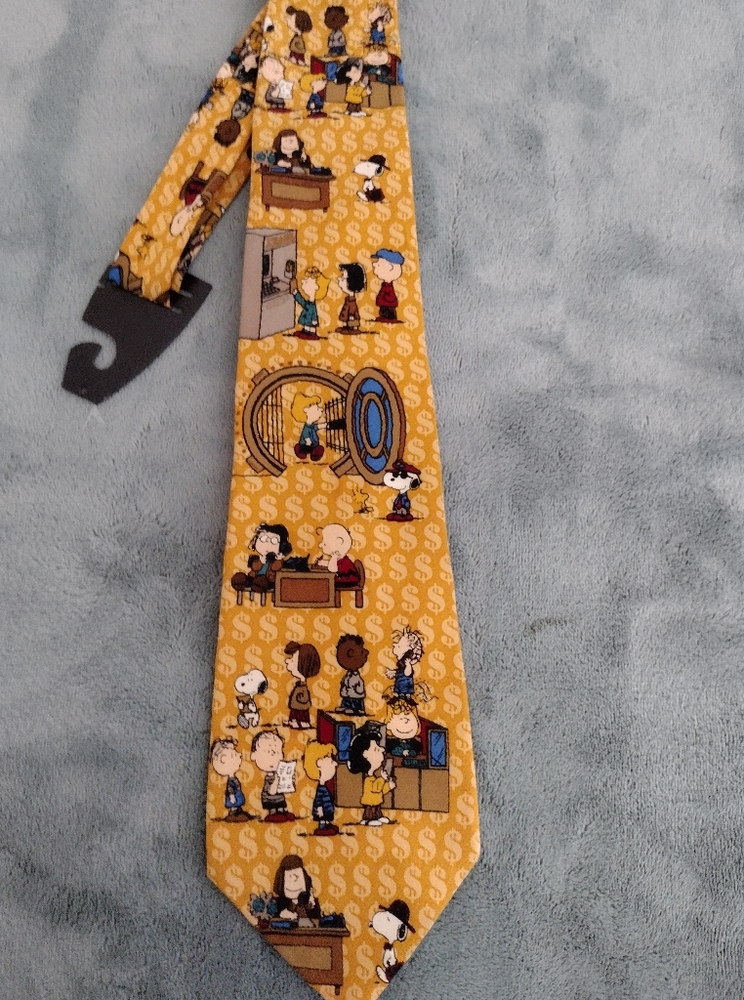 Peanuts mustard yellow tie with money $ background.